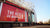 Old Trafford with Manchester United banner.