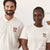 A man and a woman modelling matching off-white polo shirts and T-shirts with a brown 'ANN FIELD FLOUR' logo on the left chest.